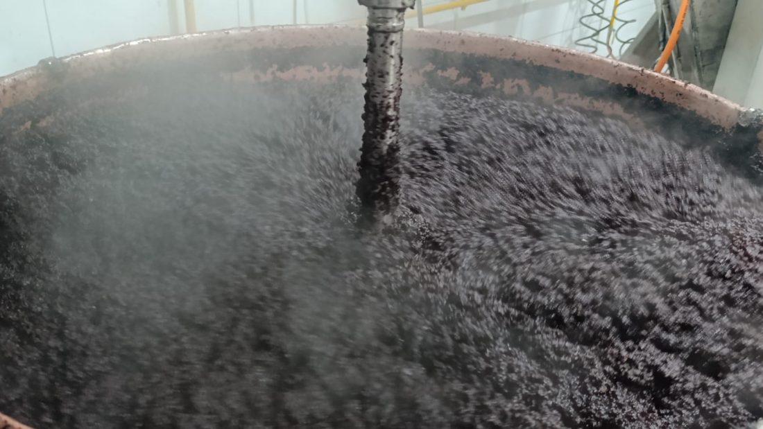 Purple carrots cooking down in the cauldron